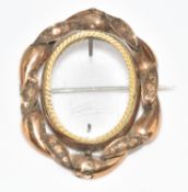 Victorian yellow metal brooch with glass locket compartment to the centre, 10g, 4.4 x 3.3cm