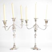 Pair of Victorian hallmarked silver candlesticks of Neoclassical form, Sheffield 1900, with three