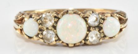 A 9ct gold ring set with three opals and cubic zirconia, 3g, size O