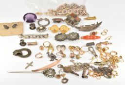A collection of damaged jewellery parts including gold plated loops/ links, gold plated barrel and