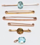 Three 9ct gold brooches (6.5g), 14ct gold brooch depicting a young woman (2.3g), a 9ct gold brooch