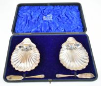 Edward VII pair of hallmarked silver shell shaped butter dishes and knives, Sheffield 1903, maker