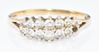 A 9ct gold ring set with cubic zirconia (one stone missing), 3.3g, size U