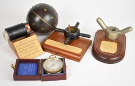 Hose clamp ring mounted on base with details of it having been from a German E boat which broke free