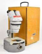 Nikon binocular microscope, number 98339, with pair of 10x eyepieces and base with mirror,