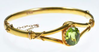 Edwardian 15ct gold bangle set with an oval cut peridot of approximately 8ct, in original box '