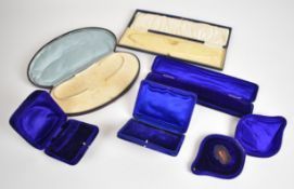 Six antique jewellery boxes including two for a necklace and four blue velvet bracelet examples