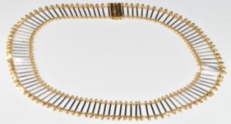 An 18ct bi-coloured gold necklace made up of cylindrical links and faceted spherical beads, 58.1g,