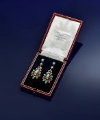 A pair of Victorian yellow metal earrings set with turquoise cabochons and black and white enamel,