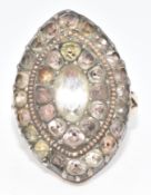 Georgian yellow metal ring set with foiled paste in a white metal marquise shaped setting, size N (