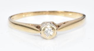 A 9ct gold ring set with a diamond, 1.1g, size N