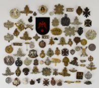 Approximately 70 cap badges and insignia, some WW2 examples, includes the Royal Highlanders,