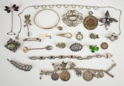 A collection of silver jewellery including bracelet with heart padlock clasp, christening bangle,
