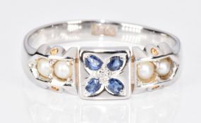 An 18ct white gold ring set with a diamond, sapphires and split pearls, 3.3g, size O