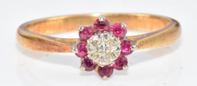 An 18ct gold ring set with a diamond and spinel, 2.6g, size L