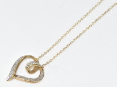 A 9ct gold heart shaped pendant set with diamonds, on 9ct gold chain, 3g, 41cm