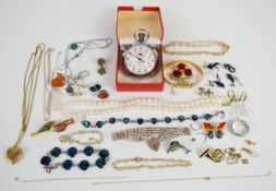 A collection of jewellery including mother of pearl cross, silver chain, silver gate bracelet with
