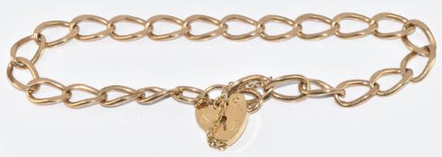 A 9ct gold curb link bracelet with heart padlock clasp, 10.1g, 18cm