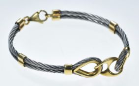 A designer steel and 18ct gold bracelet, 18.3g