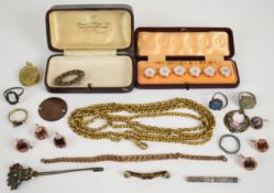 A collection of jewellery including gold plated guard chain, Victorian locket, silver ring, cut