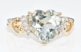 A 9ct gold ring set with a heart cut green amethyst and diamonds, 3g, size N