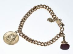 A c1900 15ct gold curb link bracelet with 9ct gold St Christopher and seal set with carnelian agate,
