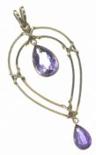 Edwardian yellow metal pendant set with two pear cut amethyst, 3.1g, 4.4 x 2cm (tests as 14ct gold)