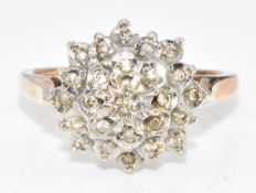 A 9ct gold ring set with diamonds in a cluster, 4.1g, size N