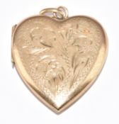 A 9ct gold heart locket with engraved scrolling decoration, 4.7g
