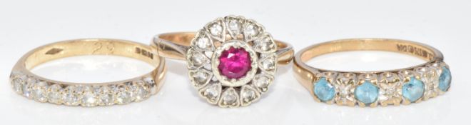 Three 9ct gold rings, one set with diamonds and topaz, one with diamonds and the other synthetic