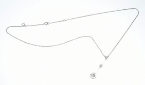A white gold necklace set with two old cut diamonds of approximately 0.6ct & 0.4ct and a citrine, in
