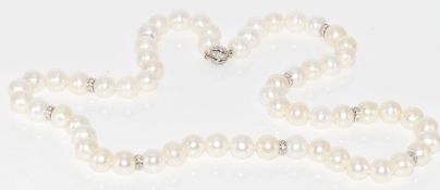 A single strand of cultured pearls with 18ct white gold spacers and sphere clasp set with