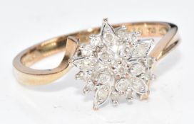 A 9ct gold ring set with round cut diamonds in a cluster setting, 2.2g, size O/P