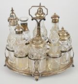 Georgian or Victorian hallmarked silver and cut glass eight bottle cruet set with oval base raised