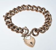 A 9ct rose gold curb link bracelet with heart padlock clasp, 28.9g, 19cm