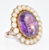 Edwardian 9ct gold ring set with an oval cut amethyst surrounded by split pearls, 6.3g, size K