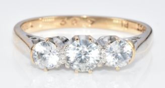 A 9ct gold ring set with three zircons in a platinum setting, 2g, size K