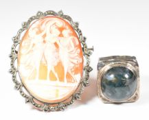 A 1970s silver ring set with a moss agate cabochon, and a silver brooch set with a cameo depicting