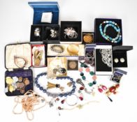 A collection of costume jewellery including two silver fobs / medallions, Swarovski earrings, Jaeger