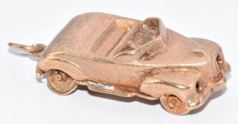 A 9ct gold charm in the form of a car, 4.9g, 2.4cm