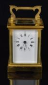 Epée French brass cased carriage clock with bevelled glass and key, H15cm
