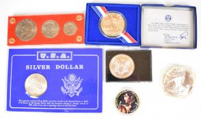 American coinage comprising 1886 Morgan dollar, 1990 silver eagle, 1987 2 troy ounce 999/1000 silver