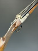 A Mino Ideal 12 bore side by side ejector shotgun with engraved scenes of birds to the locks,