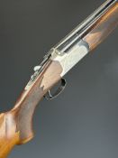 Lanber 12 bore over and under ejector shotgun with engraved action, underside, trigger guard, top