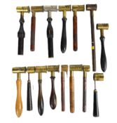 Fifteen shotgun or rifle powder measures, most with brass ends and turned wooden handles.