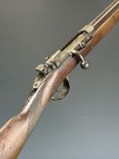 Belgian 12 bore bolt-action shotgun with chequered grip and 29.75 inch barrel choked cylinder,