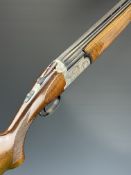 Beretta 12 bore over and under ejector shotgun with engraved action, underside, trigger guard, top