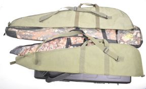 Five shotgun or rifle slips and carry cases including Nuprol padded hard case and Buffalo River.