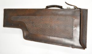 A leather leg of mutton shotgun carry case with fitted interior for a stock and two sets of barrels,