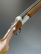 Midland 12 bore over and under ejector shotgun with engraved locks, underside, trigger guard, top